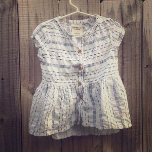 OshKosh blue and white shirt.